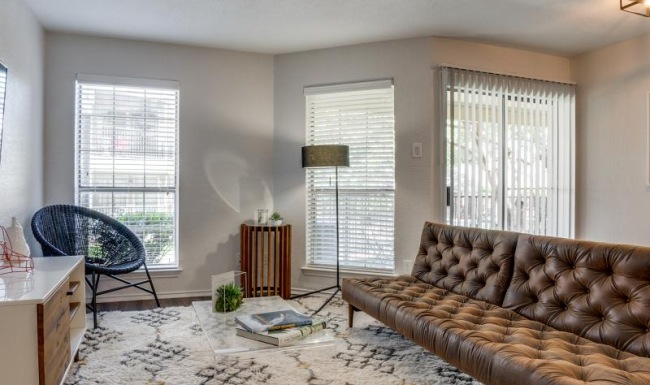 a living room with a couch and a table