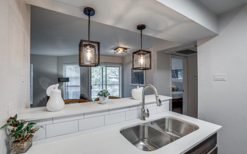 a kitchen with a large mirror